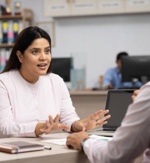 businesswoman talking to a colleague
